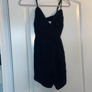 Black romper with tie in back. Stretchy back